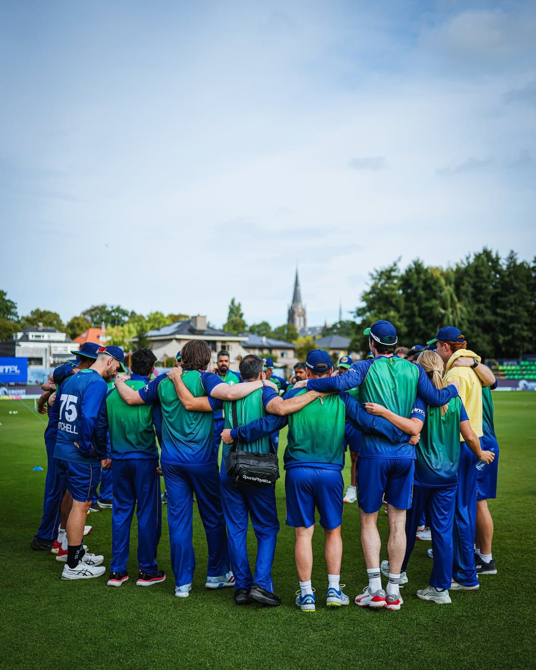 Dublin Guardians players in a team huddle on the outfield
